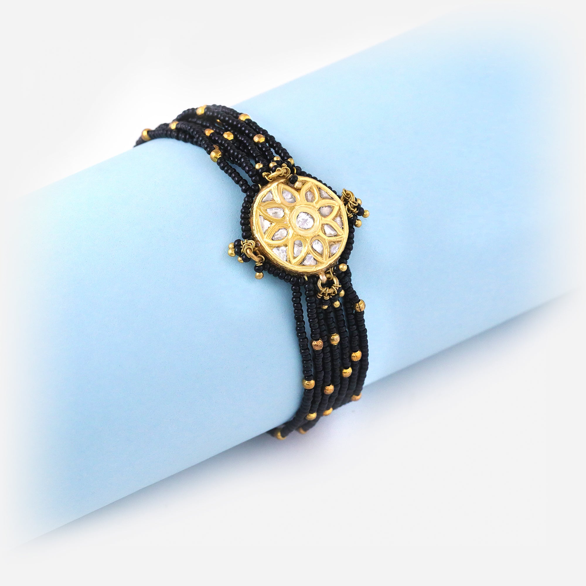 Traditional Black Bead Mangalsutra Bracelet with Gold Floral Motif